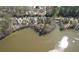 Aerial view of homes along the lakefront highlighting beautiful waterfront properties with mature trees at 2674 Hosanna Dr, Powder Springs, GA 30127