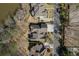 Aerial view of an upscale residential neighborhood by a lake, showcasing spacious lots at 2674 Hosanna Dr, Powder Springs, GA 30127