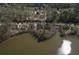 An aerial perspective displays the street with gorgeous lakefront houses nestled by the water at 2674 Hosanna Dr, Powder Springs, GA 30127