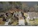 Areal view of stately home featuring three-car garage and waterfront views at 2674 Hosanna Dr, Powder Springs, GA 30127