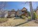 Large backyard featuring a stone patio, sunroom, and lush lawn at 2674 Hosanna Dr, Powder Springs, GA 30127