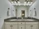 Bright bathroom with double vanity, granite counters, and stylish fixtures at 2674 Hosanna Dr, Powder Springs, GA 30127