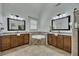 Bright bathroom boasts dual vanities, granite countertops, and a luxurious soaking tub at 2674 Hosanna Dr, Powder Springs, GA 30127
