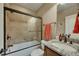 Elegant bathroom featuring a shower over tub, granite countertop and stylish fixtures at 2674 Hosanna Dr, Powder Springs, GA 30127