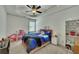 Well-lit bedroom with carpet flooring, ceiling fan, and bright decor at 2674 Hosanna Dr, Powder Springs, GA 30127