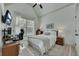 Bedroom with neutral colors, vaulted ceiling, TV and ensuite bathroom at 2674 Hosanna Dr, Powder Springs, GA 30127