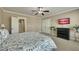 Relaxing bedroom featuring soft colors, natural light, ceiling fan, and stylish decor at 2674 Hosanna Dr, Powder Springs, GA 30127