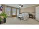 Spacious bedroom with carpet, ceiling fan, large windows, and natural light at 2674 Hosanna Dr, Powder Springs, GA 30127