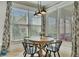Bright breakfast nook with large windows offers serene views and a comfortable dining experience at 2674 Hosanna Dr, Powder Springs, GA 30127