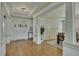 Bright foyer features hardwood floors, elegant trim, and access to the dining room and living spaces at 2674 Hosanna Dr, Powder Springs, GA 30127