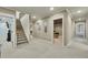 Neutral-toned hallway featuring carpet flooring, recessed lights and doorway entrances at 2674 Hosanna Dr, Powder Springs, GA 30127