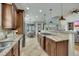 Spacious open kitchen flows to dining area and living room, featuring granite countertops and stainless appliances at 2674 Hosanna Dr, Powder Springs, GA 30127