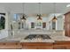 Open concept kitchen featuring granite countertops, a cooktop, and seamless flow into the living space at 2674 Hosanna Dr, Powder Springs, GA 30127