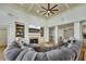 Spacious living room with a fireplace, built-in shelving, and an open view to other living spaces at 2674 Hosanna Dr, Powder Springs, GA 30127