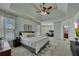 Spacious main bedroom retreat with tray ceiling, sitting area, and luxurious en-suite bathroom at 2674 Hosanna Dr, Powder Springs, GA 30127