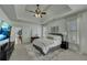 Elegant main bedroom with tray ceiling, plush carpeting, and plenty of natural light at 2674 Hosanna Dr, Powder Springs, GA 30127