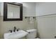 Powder room features a pedestal sink with oil rubbed bronze fixtures and wainscotting at 2674 Hosanna Dr, Powder Springs, GA 30127