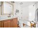 Bathroom boasts a tub-shower combination and a natural wood vanity at 66 Fair Haven Se Way, Smyrna, GA 30080