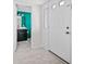 Bright entryway with view of bathroom featuring black cabinets and blue walls at 66 Fair Haven Se Way, Smyrna, GA 30080