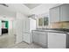Updated kitchen with stainless appliances, tile backsplash, and a window view at 66 Fair Haven Se Way, Smyrna, GA 30080