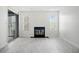 Bright living room featuring new floors, a fireplace, and a glass door to the outside at 66 Fair Haven Se Way, Smyrna, GA 30080