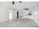 Open-concept living space with updated flooring, ceiling fan, and an open kitchen area at 66 Fair Haven Se Way, Smyrna, GA 30080