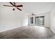 Spacious living room with sliding doors to a balcony and ceiling fans at 66 Fair Haven Se Way, Smyrna, GA 30080