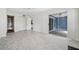 Bright living room leading to a bathroom and kitchen with modern wood-look floors at 66 Fair Haven Se Way, Smyrna, GA 30080