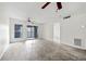 Light-filled living room with access to balcony and modern floors. Ceiling fan included at 66 Fair Haven Se Way, Smyrna, GA 30080
