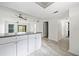 Bright living room featuring modern flooring and fan with an adjacent doorway at 66 Fair Haven Se Way, Smyrna, GA 30080