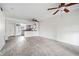 Bright living room featuring modern floors, ceiling fans, and an open kitchen area at 66 Fair Haven Se Way, Smyrna, GA 30080