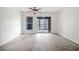 Bright living room with modern floors, ceiling fan, and balcony with sliding glass door at 66 Fair Haven Se Way, Smyrna, GA 30080
