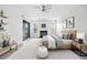 Tranquil main bedroom includes a fireplace, a ceiling fan, and sliding glass doors to outdoor balcony at 66 Fair Haven Se Way, Smyrna, GA 30080
