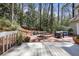 Backyard features a deck, patio and wooded area, creating a private outdoor space at 80 Seville Chase, Atlanta, GA 30328