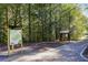 Lost Corner Preserve community trail features information kiosk, shaded walkway, and natural scenic views at 80 Seville Chase, Atlanta, GA 30328