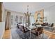 Sophisticated dining room with mirrored wall, ample seating, and natural lighting at 80 Seville Chase, Atlanta, GA 30328