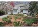 Inviting front exterior showcases a beautifully landscaped yard and classic architectural design at 80 Seville Chase, Atlanta, GA 30328