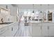 Beautiful white kitchen with stainless steel appliances and skylight to the living room at 80 Seville Chase, Atlanta, GA 30328
