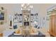 Bright living room with vaulted ceilings, built-in bookshelves, and a stone fireplace at 80 Seville Chase, Atlanta, GA 30328
