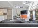 Bright living room featuring skylights, modern furnishings and bold orange cabinet at 80 Seville Chase, Atlanta, GA 30328