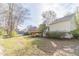 Lush backyard with a charming wooden deck, perfect for enjoying the outdoors and entertaining guests at 3005 Summit View Ct, Snellville, GA 30078