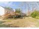 A sprawling backyard with a wooden deck, offering ample space for outdoor activities and relaxation at 3005 Summit View Ct, Snellville, GA 30078