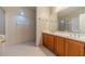 Bathroom featuring a double vanity, cabinets, and tile floors at 3005 Summit View Ct, Snellville, GA 30078