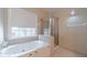 Bathroom featuring a tub, and a separate shower cabin at 3005 Summit View Ct, Snellville, GA 30078