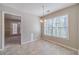 Cozy dining area with a chandelier, natural lighting, and open access to other rooms at 3005 Summit View Ct, Snellville, GA 30078
