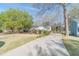 Charming home exterior featuring a long driveway and well-manicured landscaping at 3005 Summit View Ct, Snellville, GA 30078