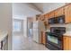 Bright eat-in kitchen with appliances, a laundry area, and natural light from a large window at 3005 Summit View Ct, Snellville, GA 30078