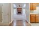 Inviting living room featuring a cozy brick fireplace, wood floors, and natural light from skylights at 3005 Summit View Ct, Snellville, GA 30078