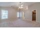 Spacious bedroom with carpet, ceiling fan, and natural light from the windows at 3005 Summit View Ct, Snellville, GA 30078