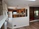 Open kitchen featuring oak cabinets and stainless appliances, with clear view to the living room at 302 Chattahoochee Way, Woodstock, GA 30188
